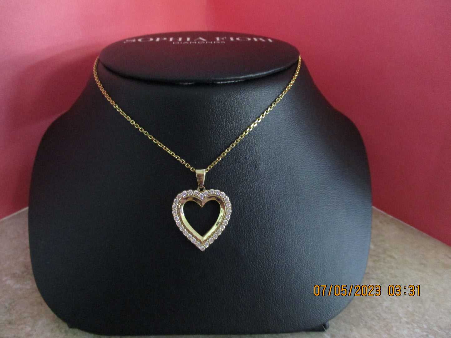 Heart Shaped Gold and Diamond Pendant